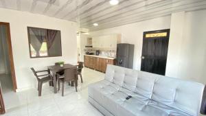 a living room with a white couch and a table at Apartamento Balcón 302 in San Luis