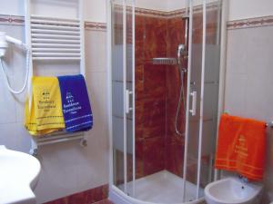 a shower with a glass door in a bathroom at Residence Hotel Torresilvana in Vieste