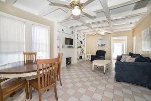 a living room with a table and a couch at Beautiful Waterfront Beach Cottage. Sleeps 6 in Clearwater Beach