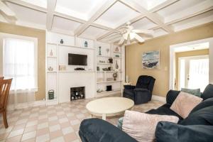 a living room with a couch and a table at Beautiful Waterfront Beach Cottage. Sleeps 6 in Clearwater Beach