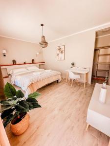 a large bedroom with a bed and a desk at Hotel La Casona del Desierto in Huasco