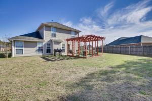 a yard with a playground in front of a house at Spacious Family-Friendly Home in Denham Springs! in Denham Springs