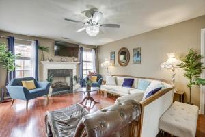 a living room with a couch and a fireplace at Spacious Family-Friendly Home in Denham Springs! in Denham Springs