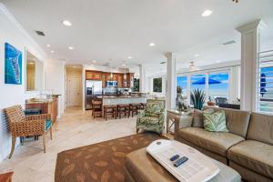 an open living room with a couch and a kitchen at The Blue Horizon in Bradenton Beach