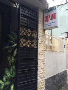 a door on the side of a building with a sign at Diep Anh Guest House in Ho Chi Minh City