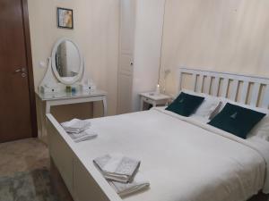 a bedroom with a large white bed with a mirror at Sea Bliss Retreat -Santa Marina - Sozopol in Sozopol +29 photos