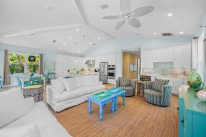 a living room with a couch and a table at Southern Exposure AMV in Anna Maria