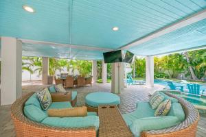a living room with a pool and a blue ceiling at Southern Exposure AMV in Anna Maria