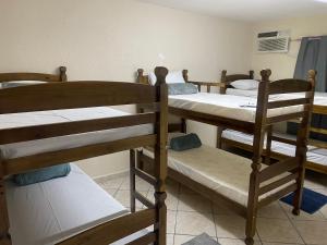 a group of bunk beds in a room at Garden Hostel - Santana in Sao Paulo