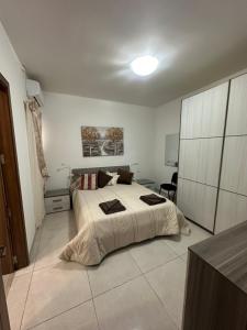 Voodi või voodid majutusasutuse Orchidea Appartment toas