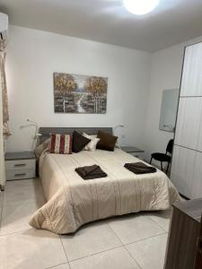 Voodi või voodid majutusasutuse Orchidea Appartment toas
