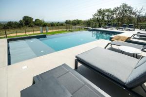 The swimming pool at or close to Mas Sureda - Evasion luxueuse avec vue panoramique
