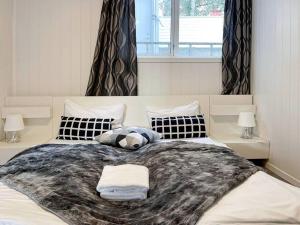 a bedroom with a large bed with two lamps at Stavanger BnB 4 by Sidd in Stavanger