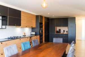 A kitchen or kitchenette at Mas Sureda - Evasion luxueuse avec vue panoramique