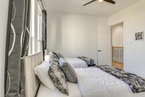 a bedroom with two beds and a window at Houston Retreat with Balcony, 1 Mi to Toyota Center! in Houston