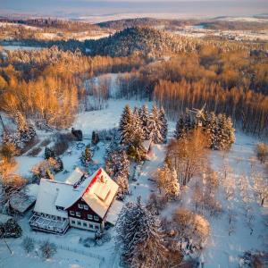 an aerial view of a house covered in snow at Zającówka in Polanica-Zdrój