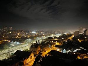 a view of a city at night at Loronobeo.forest in Belgrade
