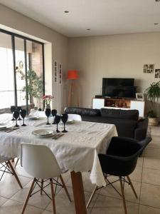 a dining room table with a white table cloth on it at Departament de categoría excelente ubicación in Mendoza