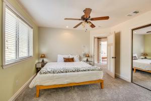 a bedroom with a bed and a ceiling fan at Expansive Mountain Gem Game Room, 3 Mi to Acton in Ravenna +31 photos