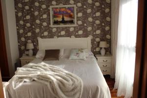 a bedroom with a bed with a blanket on it at Residentium Spain -Chalet la Dorada pets friendly in Cambrils