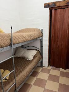 a couple of bunk beds in a room at Algarrobos del Mirador in Santa Rosa de Calamuchita
