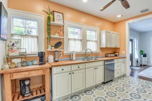 a kitchen with white cabinets and a sink at Private Pool and Yard Dog-Friendly Bradenton Home in Bradenton