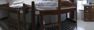 two sets of bunk beds in a room at Pacifico Seaside Lodge in Moalboal