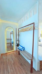 a bedroom with a bunk bed and a mirror at Sandy Heaven Maldives in Gulhi