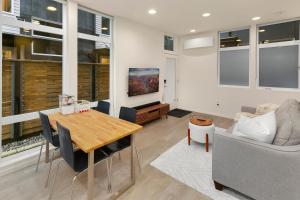 a living room with a table and a couch at Metro Malden BY Betterstay in Seattle
