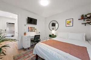 a bedroom with a bed and a desk and a chair at Urban Abode 22 BY Betterstay in Seattle