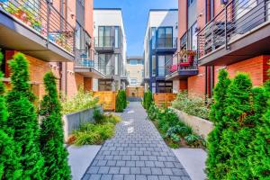 an alley in an apartment building with plants at Urban Abode 22 BY Betterstay in Seattle