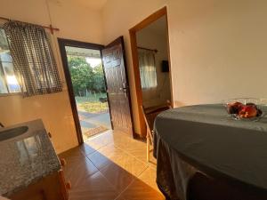 a room with a table with a bowl of fruit on it at Apto en Minas con amplio fondo, aire acondicionado, ideal para descansar in Minas