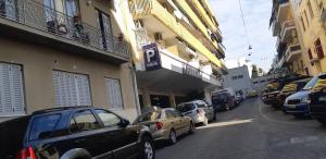 a group of cars parked on the side of a street at Luxury apartment 3 rooms near metro in Athens