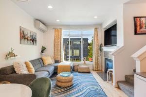 a living room with a couch and a table at Lakeview Charm BY Betterstay in Seattle