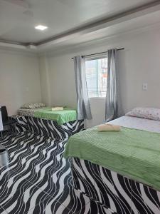 Cama ou camas em um quarto em 3D Hotel