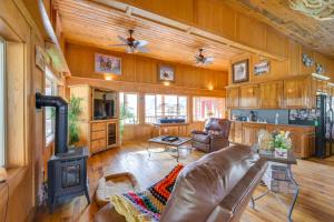 a living room with a couch and a stove at Salmon Vacation Rental with Mountain Views! in Salmon