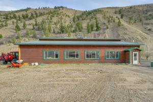 a small house in the middle of a mountain at Salmon Vacation Rental with On-Site River Access! in Salmon