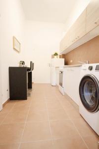 a laundry room with a washer and dryer at Family apartment in Brigittenau in Vienna