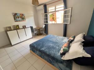 Φωτογραφία από το άλμπουμ του Villa Iguana, duplex paisible, vue magnifique mer et rocher du Diamant, piscine σε Sainte-Luce