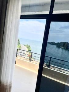 a view of the ocean from a window at Contemporary Suite in Kibuye