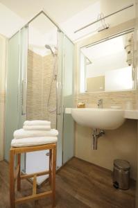 a bathroom with a sink and a mirror at Locanda Dogana in Peschiera del Garda