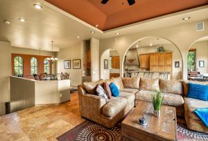 a living room with a couch and a table at Great Sedona Home Sensational Views! in Sedona