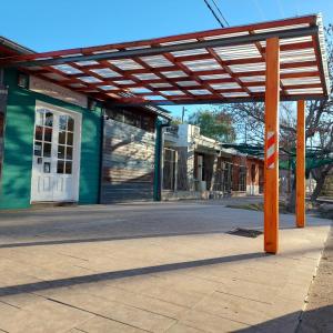 awning over an empty street in front of a building at Hotel Segundo Roma in Villa La Paz