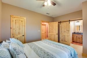 a bedroom with a large bed with wooden cabinets at Rural Drexel Cabin on 30 Acres Unplug and Unwind! in Drexel