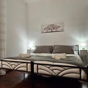 Postel nebo postele na pokoji v ubytování Corteantica Rho Fiera 1
