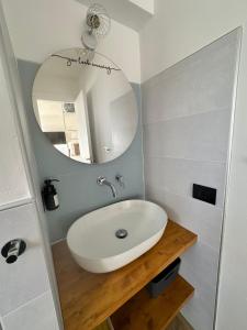 a bathroom with a sink and a mirror at Casa Amanda in Sestriere