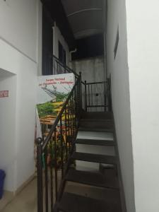 a staircase in a building with a sign on it at Apartahotel San Miguel in San Gil