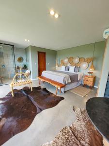 a bedroom with a large bed with a wooden headboard at Taboo Milagres in São Miguel dos Milagres