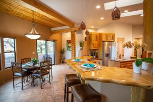 a kitchen and dining room with a table and chairs at Spectacular Sedona Destination with Pool & Spa in Sedona