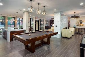 a living room with a pool table in it at Modern Luxury Fully Furnished 2BRM & 2Bath Downtown Atlanta Apartment in Atlanta
